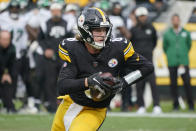 Pittsburgh Steelers quarterback Kenny Pickett (8) scrambles against the New York Jets during the second half of an NFL football game, Sunday, Oct. 2, 2022, in Pittsburgh. (AP Photo/Gene J. Puskar)