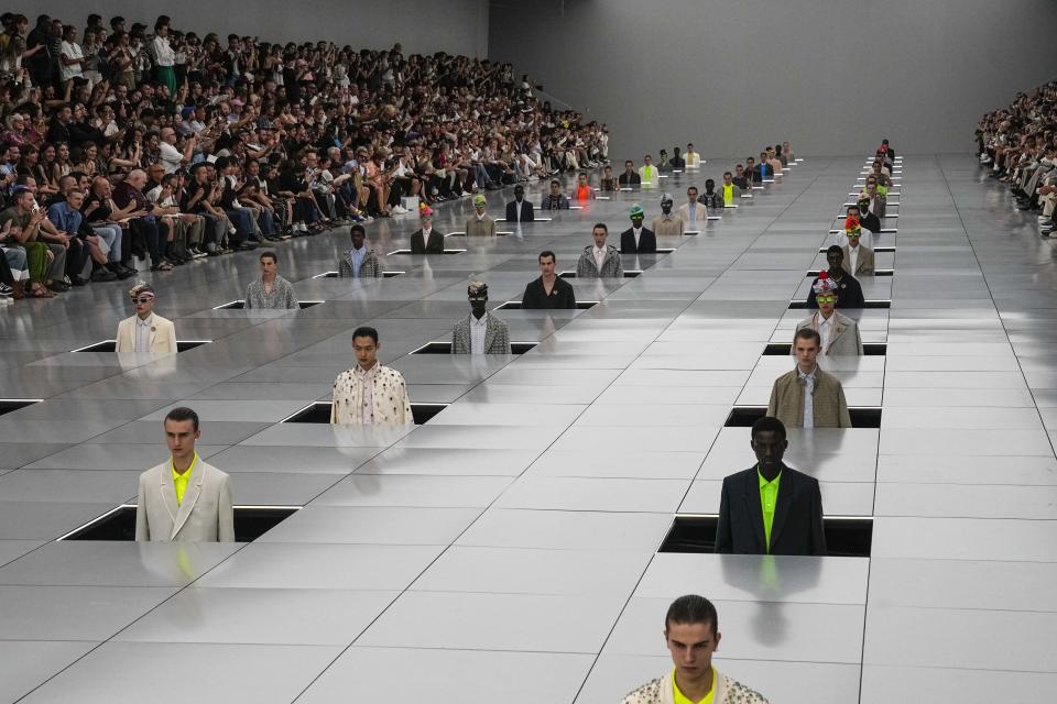 Models wear creations for the Dior Menswear Spring/Summer 2024 fashion collection presented in Paris, Friday, June 23, 2023. (AP Photo/Michel Euler)