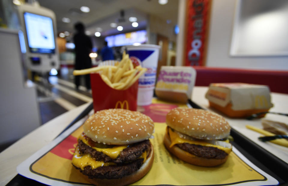 A McDonald's Quarter Pounder, right and a Double Quarter Pound burger is shown with the new fresh beef, Tuesday, March 6, 2018, in Atlanta.  (Photo: Mike Stewart/AP) 