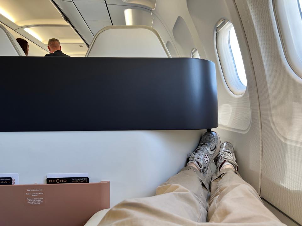 A passenger's point of view on board a Beond A319, with the seat as a lie-down bed shows how the foot rest is cramped