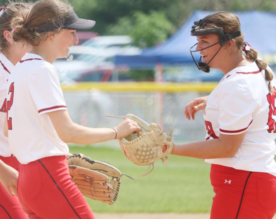 Arlington's Brenley Goebel and pitcher Taya Clausen (right) share a moment during the Cardinals' 4-0 shutout win over Bon Homme in the Class B third-place game of  the South Dakota State High School Softball Championships on Saturday, June 3, 2023 in Aberdeen.