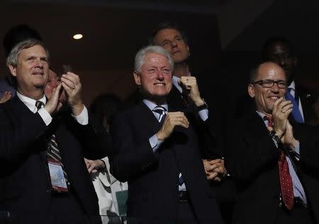 Former U.S. President Bill Clinton pumps his fist during President Barack Obama's speech on the third day of the Democratic National Convention in Philadelphia, Pennsylvania, U.S. July 27, 2016. REUTERS/Mike Segar