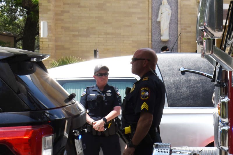 Uvalde Police officers stand outside of Sacred Heart Catholic Church during funeral services for 10 year old Uvalde school shooting victim Amerie Jo Garza days after the tragedy at Robb Elementary School in Uvalde, Texas on May 31, 2022. On Wednesday, the Justice Department announced it will provide technical assistance to rebuild trust between Uvalde police and the community after its review found "a series of major failures." File Photo by Jon Farina/UPI