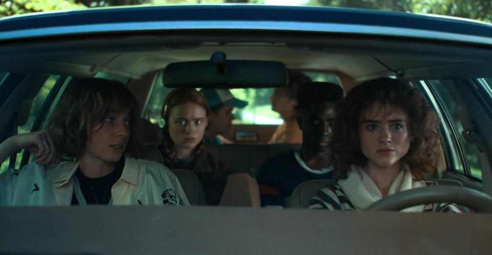 Maya Hawke as Robin Buckley, Sadie Sink as Max Mayfield, Gaten Matarazzo as Dustin Henderson, Joe Keery as Steve Harrington, Caleb McLaughlin as Lucas Sinclair, and Natalia Dyer as Nancy Wheeler in STRANGER THINGS