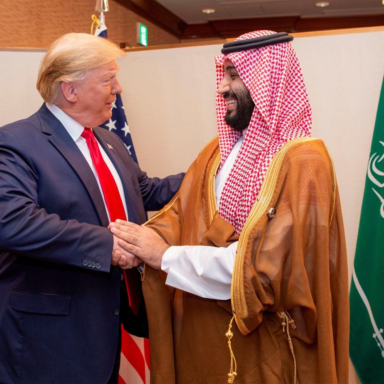 Saudi Arabia's Crown Prince Mohammed bin Salman shakes hands with U.S. President Donald Trump, at the G20 leaders summit in Osaka - Reuters