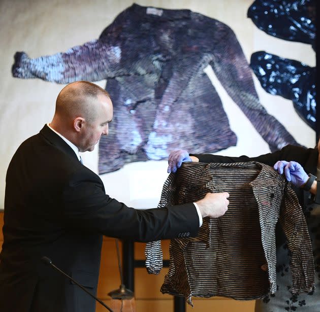 Connecticut State Police Sgt. Kevin Duggan points to a blood-like stain on a women's long-sleeve shirt taken from a trash can on Albany Avenue in Hartford as he testifies on day eight of Michelle Troconis' criminal trial in Stamford on Jan. 23. The blood was later determined to match Jennifer Dulos' DNA.