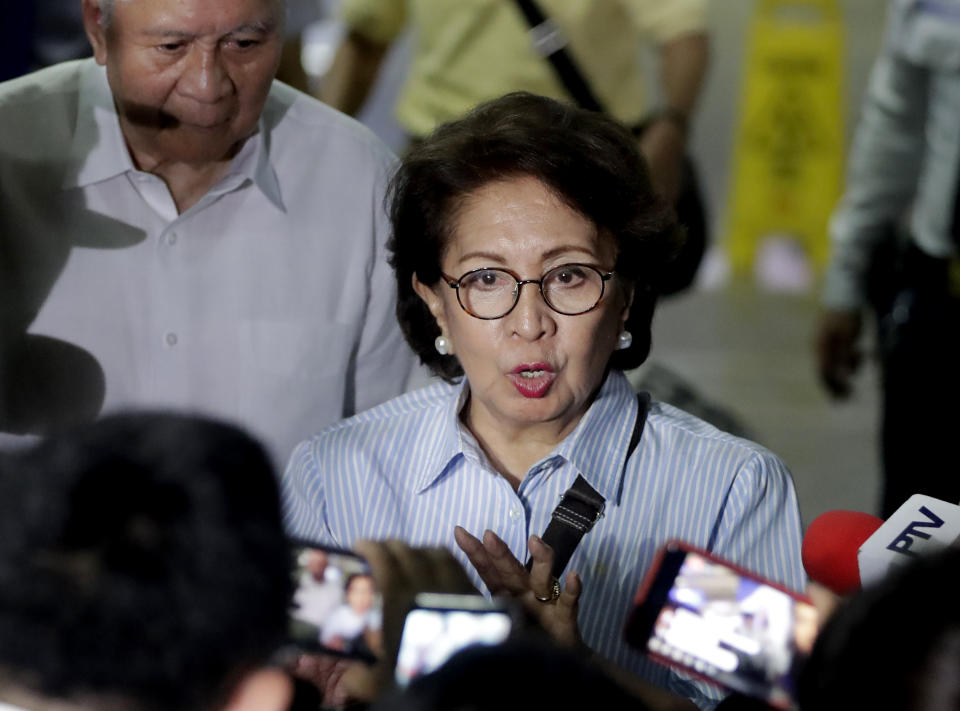 Former Philippine Supreme Court justice Conchita Carpio-Morales talks to reporters upon arrival at the Ninoy Aquino International Airport from Hong Kong where she was stopped by Immigration authorities and was held in a room at Hong Kong's airport and ordered to take a flight back to Manila, Tuesday, May 21, 2019 in suburban Pasay city south of Manila, Philippines. Carpio-Morales, along with former Foreign Affairs Secretary Albert Del Rosario, once accused Chinese President Xi Jinping of crimes against humanity before the International Criminal Court. (AP Photo/Bullit Marquez)