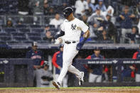 New York Yankees' Aaron Hicks scores on an error by Boston Red Sox right fielder Rob Refsnyder during the sixth inning of a baseball game, Sunday, Sept. 25, 2022, in New York. (AP Photo/Jessie Alcheh)