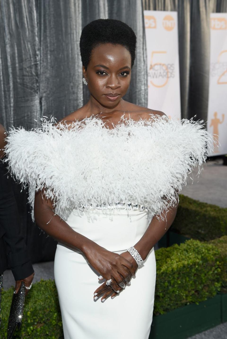 <p><strong>Danai Gurira </strong>knows how to rock a short natural hairstyle either casual or glam, as seen here, and is right on trend. "I think we will see even more people embracing their hair texture and wearing their hair in its natural state!" Porsche says. "More brands than ever are coming out with curly hair lines, so there are <a href="https://www.goodhousekeeping.com/beauty/hair/g34838457/best-natural-hair-products/" rel="nofollow noopener" target="_blank" data-ylk="slk:many products;elm:context_link;itc:0;sec:content-canvas" class="link ">many products</a> to choose from to improve overall health and curl definition."</p>