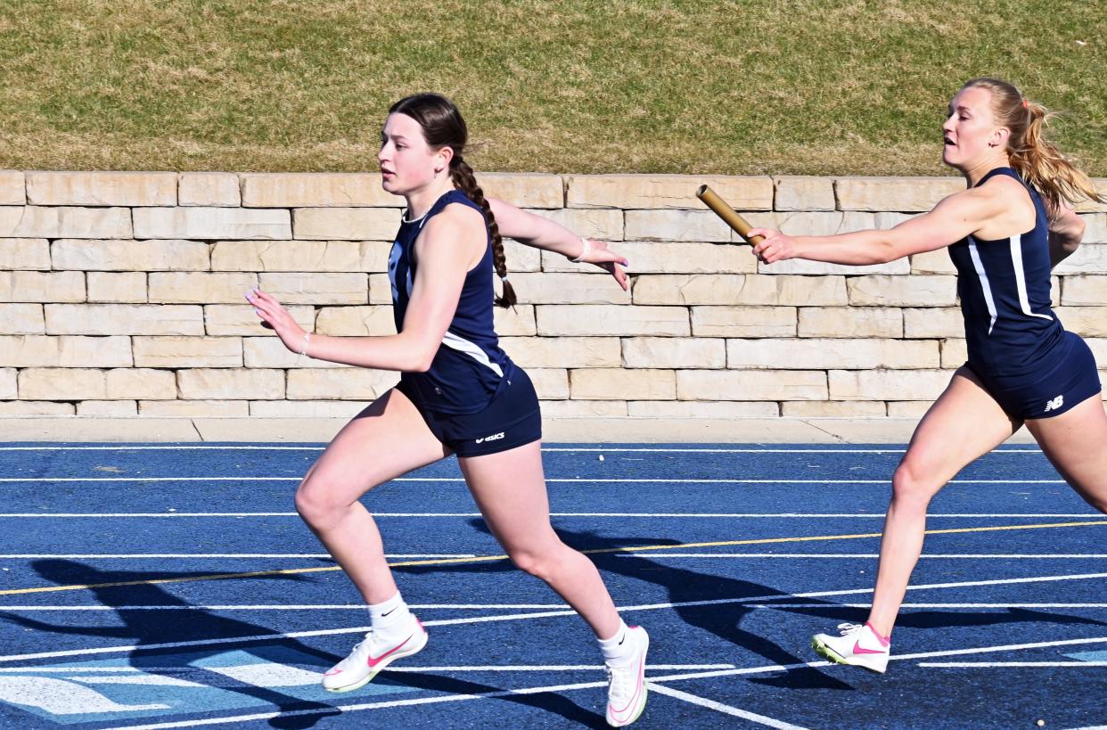 Petoskey's Emma Mitas (front) and Madeline Loe (back) each had some individual success and helped PHS earn wins within the relay events as well at the BNC finals in Cadillac.