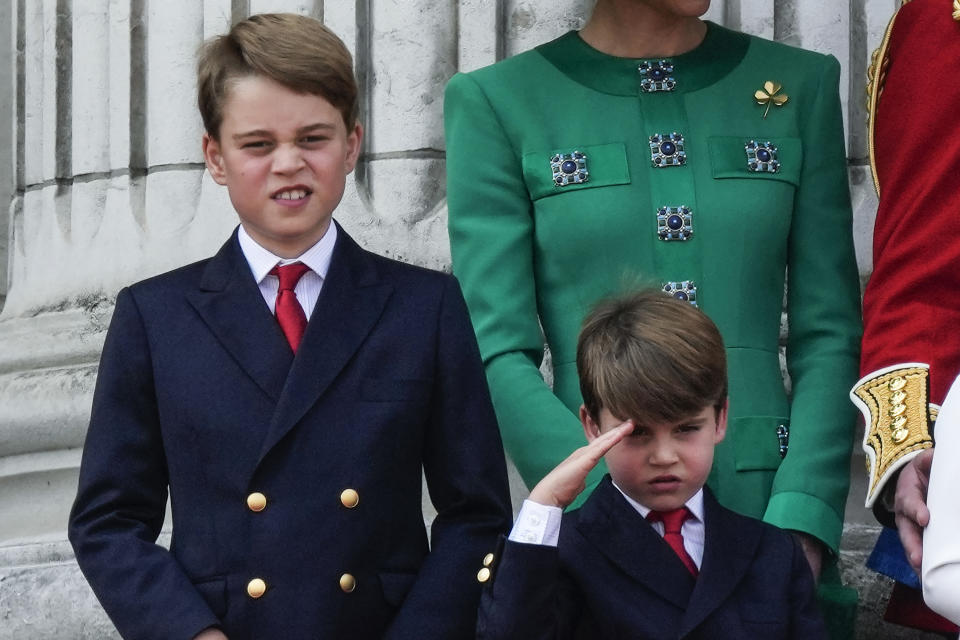 Prince George, left, and Prince Louis, greet the crowd from the balcony of Buckingham Palace after the Trooping The Colour parade, in London, Saturday, June 17, 2023. Trooping the Colour is the King's Birthday Parade and one of the nation's most impressive and iconic annual events attended by almost every member of the Royal Family.(AP Photo/Alastair Grant)