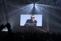 Chris Martin of British band 'Coldplay' (L) duets with a recording of late British pop icon George Michael during the BRIT Awards 2017 ceremony and live show in London on February 22, 2017