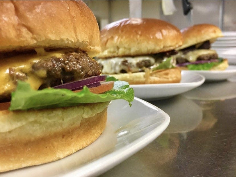 A Flavor Burger in between two Perfect Patty burgers at Flavor 91 Bistro.