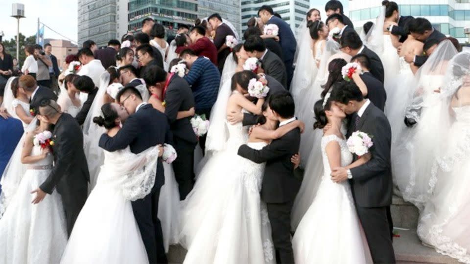 Chinese couples in group wedding ceremony, By 2020 China is expected to have 30 million men without a partner. Photo: AP