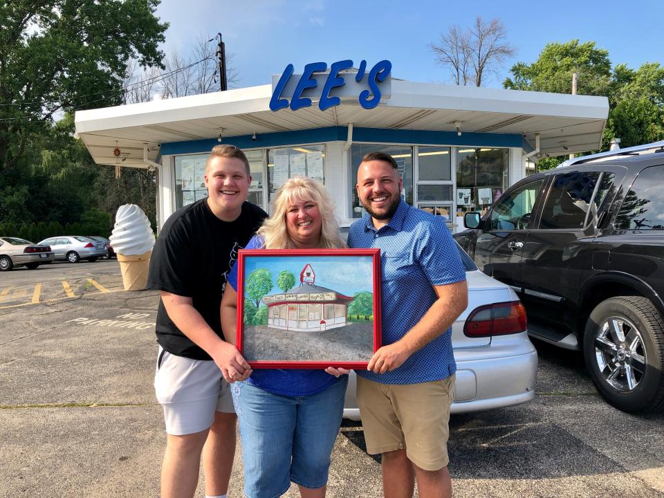 The Janik family, from left, Nate Janik, Danette Bugs-Janik and Nikolas Janik stand outside Lee's Dairy Treat in Brookfield.