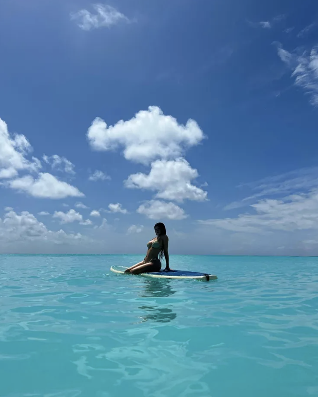 Kylie Jenner poses on a paddleboard on a tropical vacation. (Photo: Kylie Jenner/Instagram)