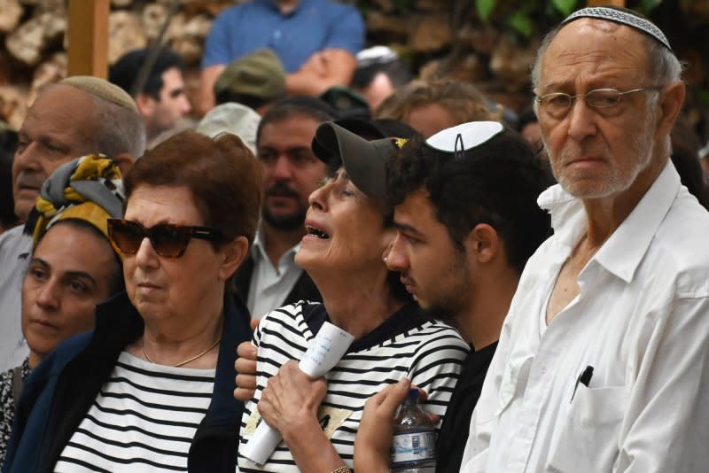 The mother of Col. Roi Levy, commander of the elite 'Ghost' multi-dimensional unit, weeps at his funeral in the Mt. Herzl Military Cemetery in Jerusalem, on Monday. Photo by Debbie Hill/ UPI