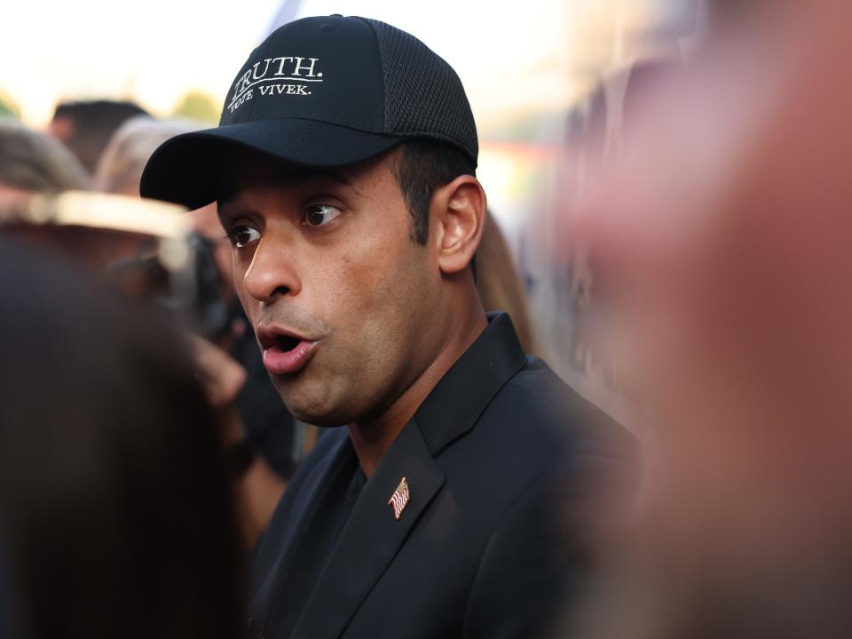 Vivek Ramaswamy speaks to the press following a small rally outside of the Fiserv Forum on August 22, 2023