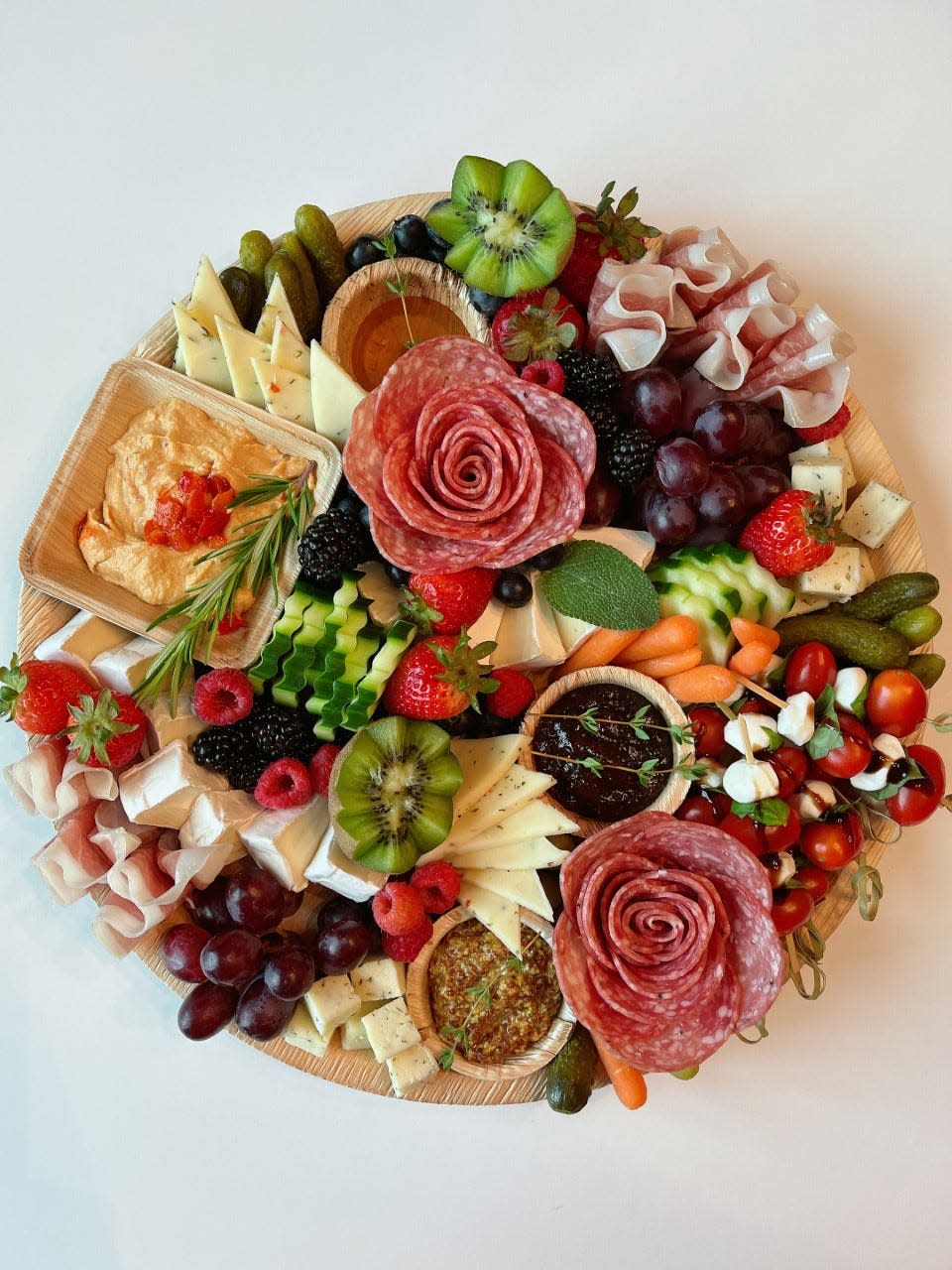 bites on a board specializes in charcuterie boards and other gourmet food items.