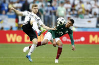 <p>Germany’s Timo Werner, left and Mexico’s Edson Alvarez compete for the ball (AP) </p>
