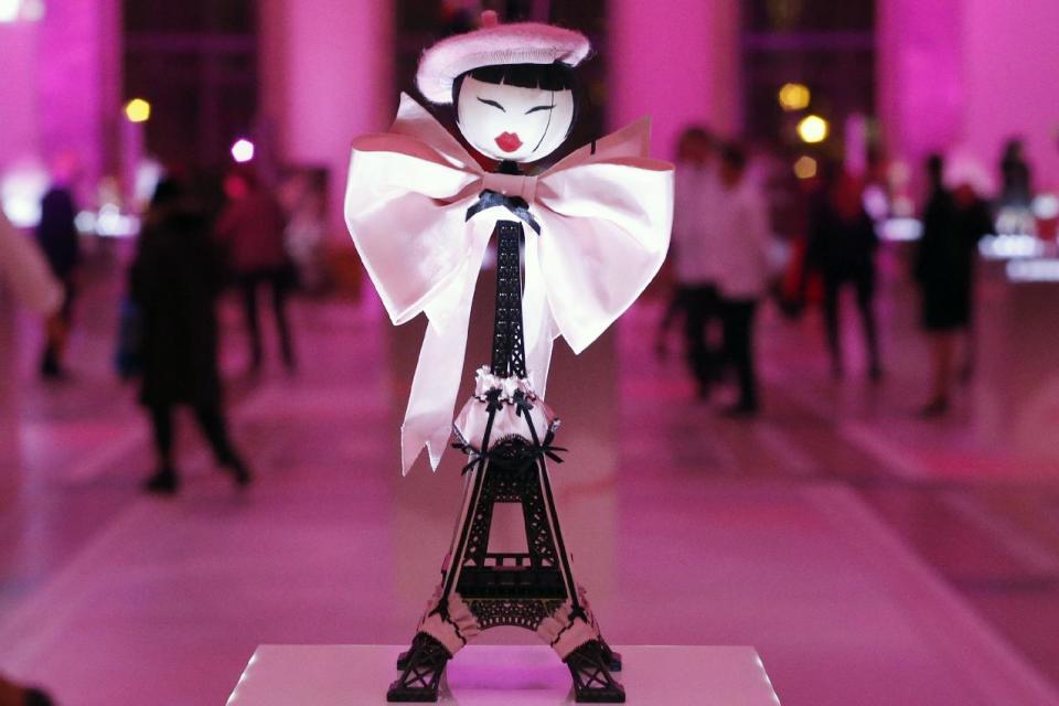 A creation designed by Chantal Thomass displayed at the Petit Palais, in Paris, Monday Nov. 25, 2013. The world's top fashion houses from Chanel, Prada and Christian Dior have brought together their needlework in a unique charitable venture: each designing children's dolls that will be sold at auction for UNICEF.(AP Photo/Francois Mori)