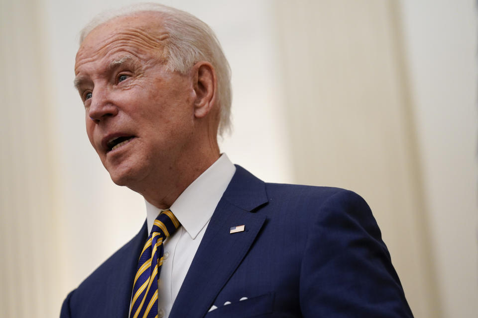 President Joe Biden delivers remarks on the economy in the State Dining Room of the White House, Friday, Jan. 22, 2021, in Washington. (AP Photo/Evan Vucci)