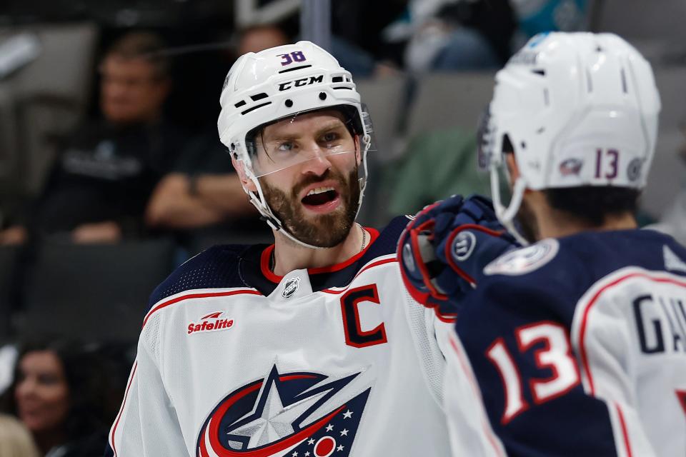 Columbus Blue Jackets center Boone Jenner (38) celebrates his goal against the San Jose Sharks with left wing Johnny Gaudreau (13) during the second period of an NHL hockey game in San Jose, Calif., Tuesday, March 14, 2023. (AP Photo/Josie Lepe)