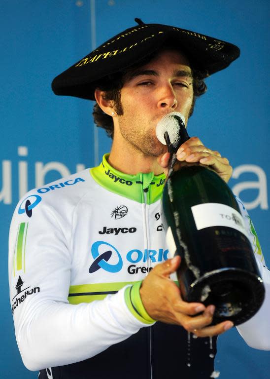 Team Orica Greenedge's Australian cyclist Michael Matthews drinks champagne on the podium after winning the third stage of the Tour of the Basque Country, a 194.5 km ride from Urdazubi-Urdax to Vitoria, northern Spain, on April 9, 2014