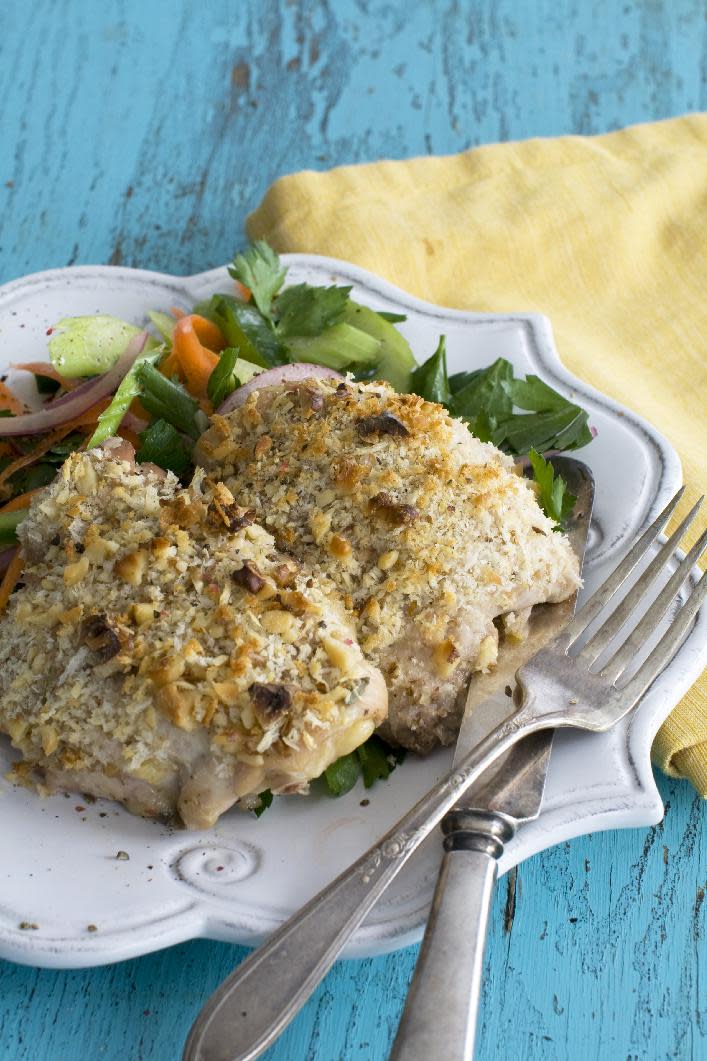 This March 18, 2013 photo taken in Concord, N.H. shows a recipe for herb-brined, walnut-crusted chicken thighs. (AP Photo/Matthew Mead)