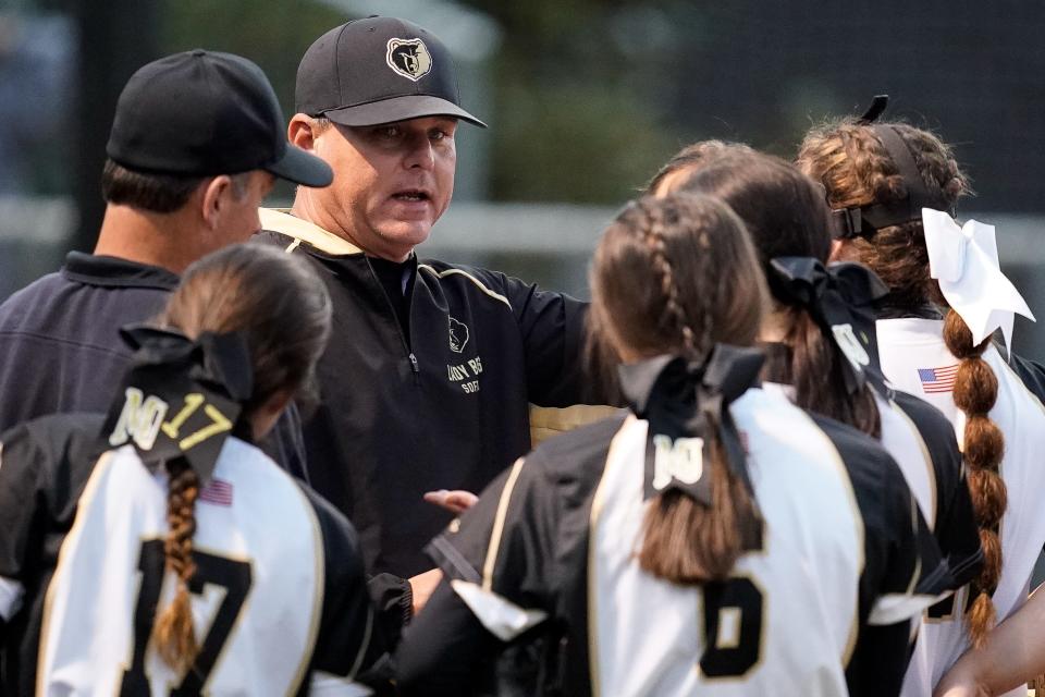 Mt. Juliet's head coach Kevin Costley works with his team against Smyrna during the first inning at Mt. Juliet High School in Mt. Juliet, Tenn., Monday, April 4, 2022.