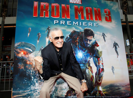 FILE PHOTO: Stan Lee gestures as he poses at the premiere of "Iron Man 3" at El Capitan theatre in Hollywood, California, U.S., April 24, 2013. REUTERS/Mario Anzuoni/File Photo