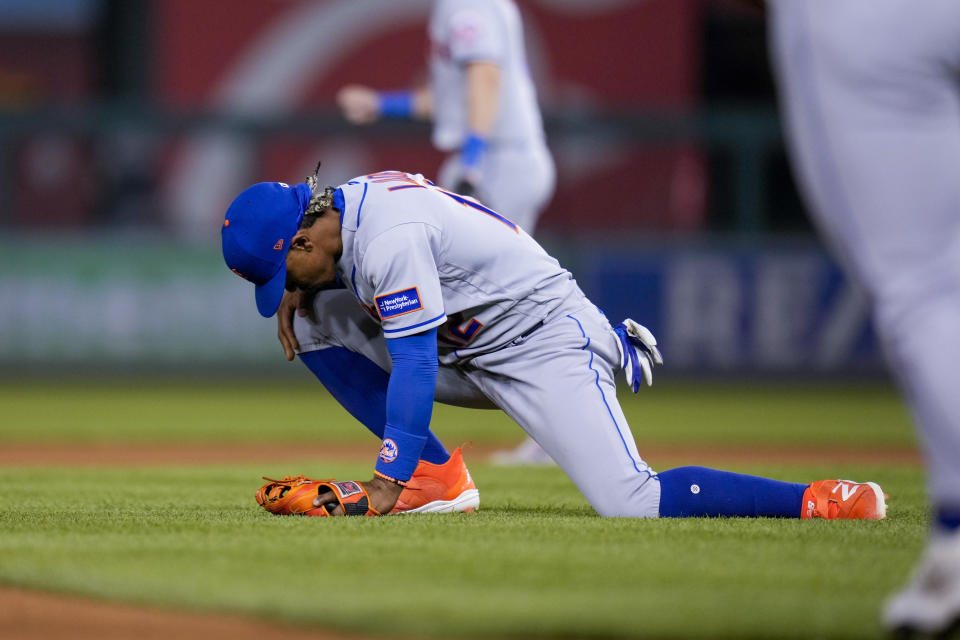 New York Mets shortstop Francisco Lindor reacts after making an error on a ball hit by Washington Nationals' Jacob Alu, scoring a run, during the fourth inning of a baseball game at Nationals Park, Friday, May 12, 2023, in Washington. (AP Photo/Alex Brandon)