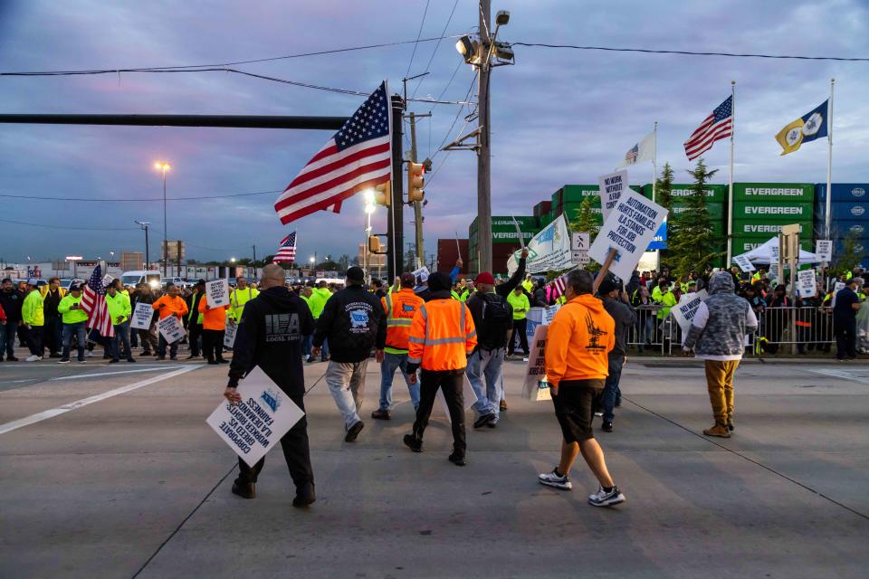 <p>Bloomberg / Contributor / Getty Images</p> Workers picket outside the APM container terminal at the Port of Newark in Newark, New Jersey on Oct. 1, 2024