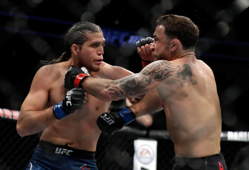 Frankie Edgar (R) and Brian Ortega fight during their featherweight bout during UFC 222 at T-Mobile Arena on March 3, 2018, in Las Vegas. Ortega won by TKO. (Getty Images)