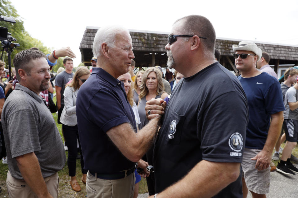 Democratic presidential candidate former Vice President Joe Biden greets a local resident during the Hawkeye Area Labor Council Labor Day Picnic, Monday, Sept. 2, 2019, in Cedar Rapids, Iowa. (AP Photo/Charlie Neibergall)