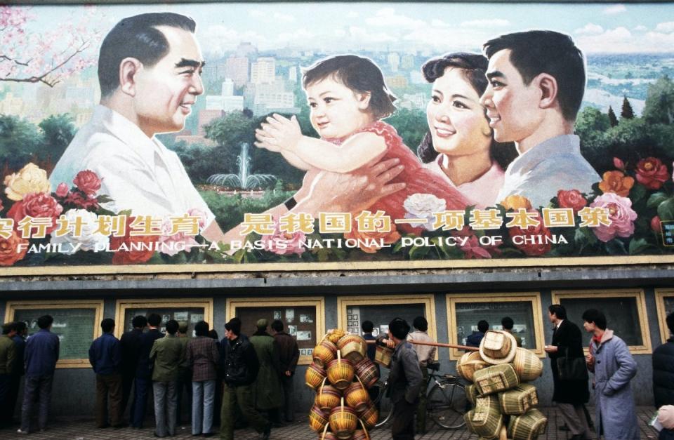 For four decades, the Chinese government has restricted family size. <a href="https://www.gettyimages.com/detail/news-photo/pedestrians-and-a-man-carrying-baskets-pass-by-a-huge-news-photo/158661292?adppopup=true" rel="nofollow noopener" target="_blank" data-ylk="slk:Peter Charlesworth/LightRocket via Getty Images;elm:context_link;itc:0;sec:content-canvas" class="link ">Peter Charlesworth/LightRocket via Getty Images </a>