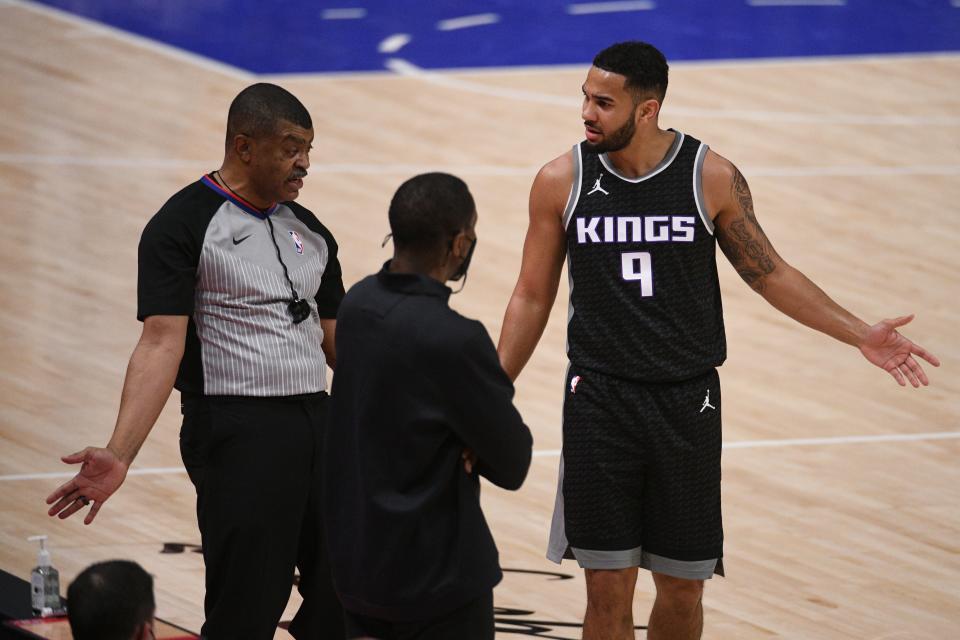 Kings guard Cory Joseph argues with a ref as Pistons coach Dwane Casey listens Feb. 26, 2021 in Detroit.