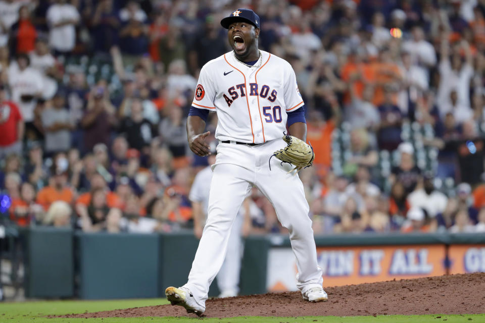 Houston Astros closing pitcher Hector Neris reacts as after striking out Chicago White Sox's Yoan Moncada for the final out in the ninth inning of a baseball game Saturday, April 1, 2023, in Houston. (AP Photo/Michael Wyke)