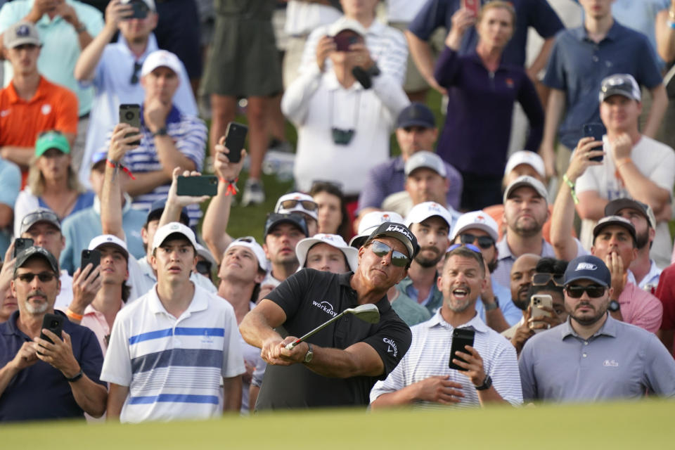 Phil Mickelson chips to the 18th green during the third round at the PGA Championship golf tournament on the Ocean Course, Saturday, May 22, 2021, in Kiawah Island, S.C. (AP Photo/Matt York)
