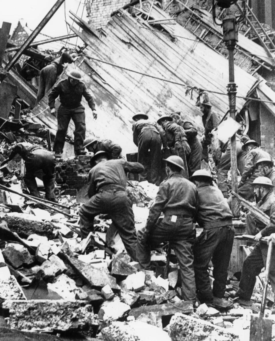 London firefighters are searching for survivors in the rubble of a destroyed printing works, after a night of German firebombings on the British capital.