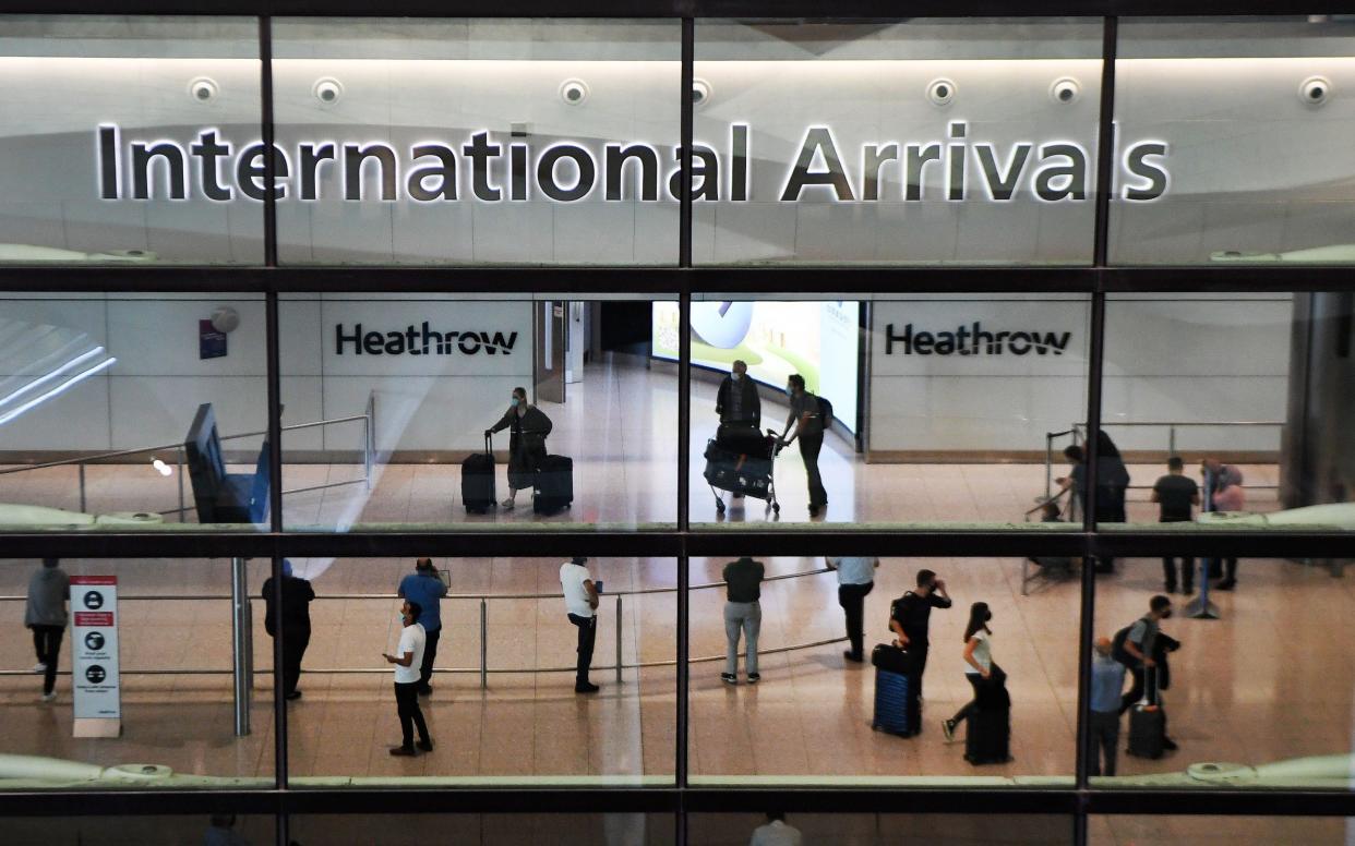 A committee says the Government's "inexplicable" decision to lift restrictions on about one million people who arrived in the UK contributed to the scale of the outbreak - ANDY RAIN/EPA-EFE/Shutterstock