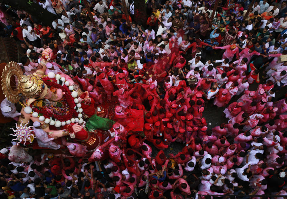 Hindu devotees participate in a procession towards the Arabian Sea