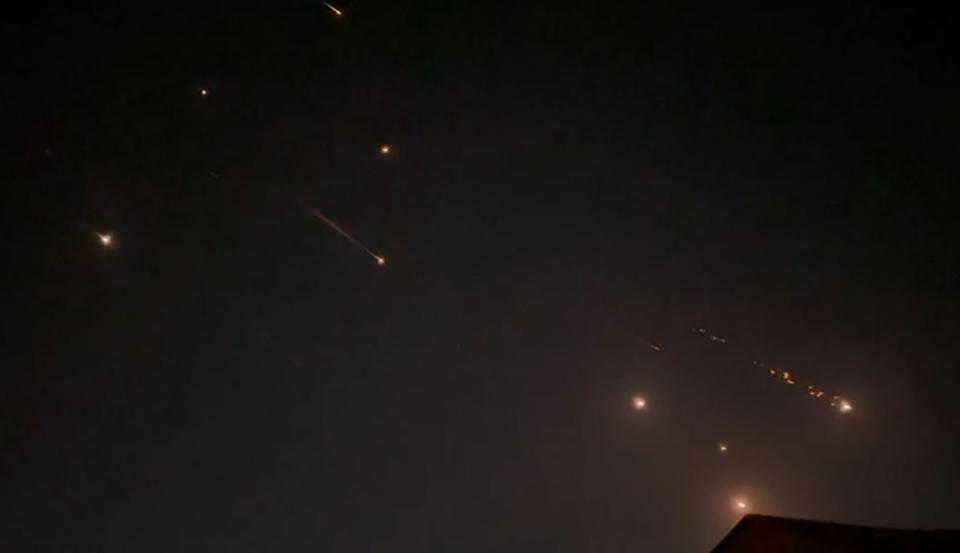 This video grab from AFPTV taken on 14 April  2024 shows explosions lighting up the sky in Hebron, Palestinian Territories, during an Iranian attack on Israel (AFPTV/AFP via Getty Images)