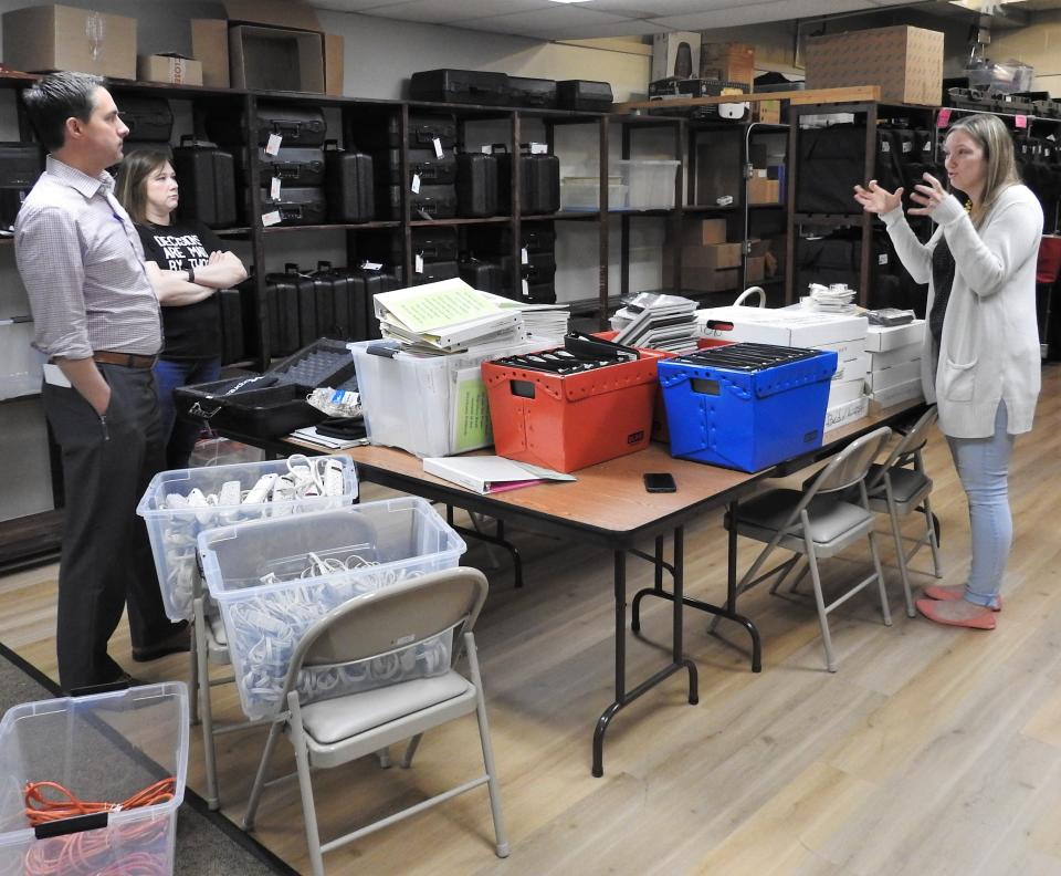 Ohio Secretary of State Frank LaRose and Coshocton County Board of Elections Director Kirsten Ross listen to Deputy Director Stephanie Slifko as she speaks Tuesday at the BOE office. LaRose made a routine stop to check on the board to see if it was ready for the May 3 primary.