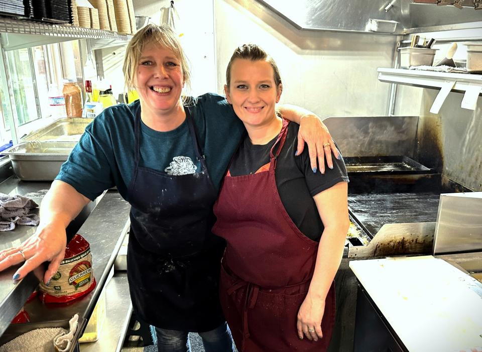 Roadrunner Grill owner Robin Evans, left, poses with employee Kristen Wampler in the kitchen of the Shasta Lake restaurant in January 2024.