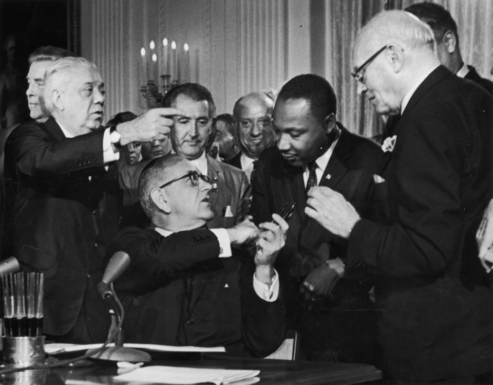 The signing of the Civil Rights Act of 1964.