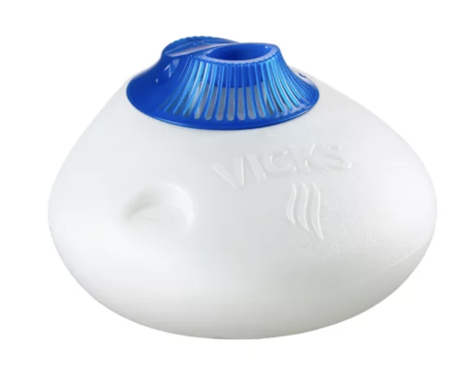 Vicks Vaporizer Pure Steam Warm Mist Air Humidifier with Night-Light & Medicine Cup in white with blue top (Photo via Canadian Tire)