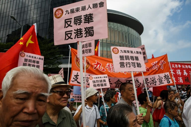 Pro-Beijing demonstrators gather outside the Legislative Council in Hong Kong, on October 26, 2016