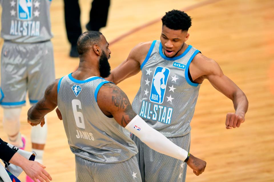 LeBron James and Giannis Antetokounmpo celebrate after helping Team LeBron win the All-Star Game.