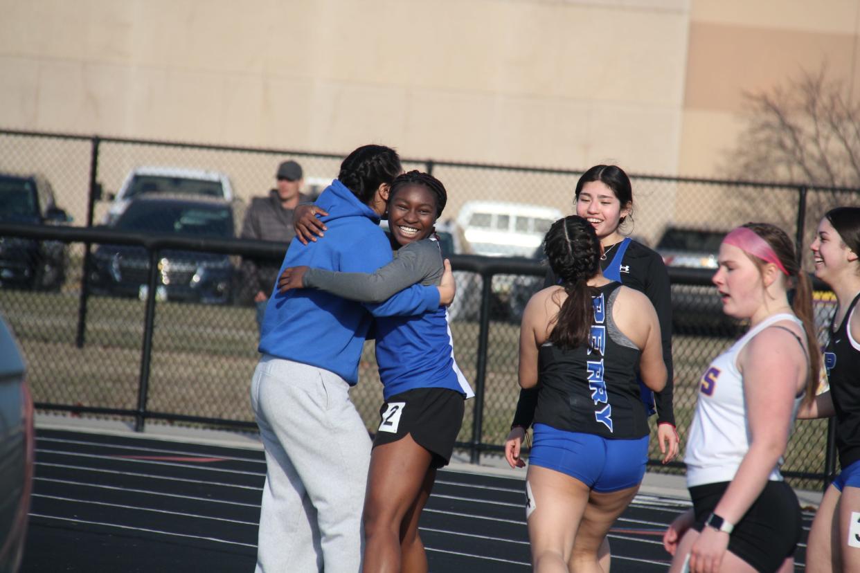 Perry's Treasure Moore gets a hug after placing second in the 100-meter dash during the Jayette Relays on Thursday, March 28, 2024, in Perry.